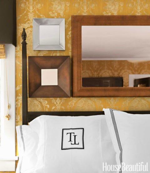 vintage mirrors over bed