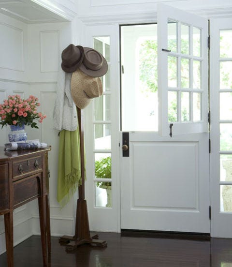 foyer with dutch door and coat rack