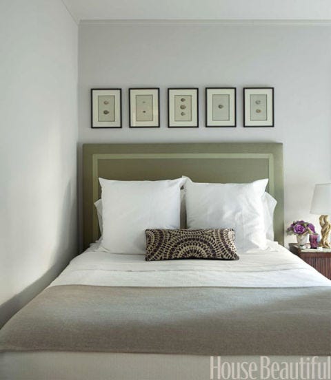 bed with green headboard and white pillows