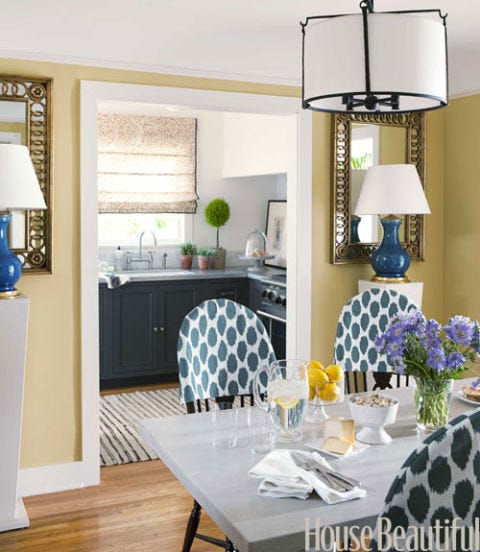 yellow dining room with blue lamps