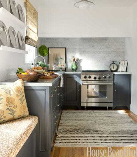 kitchen with gray cabinets and a braided rug