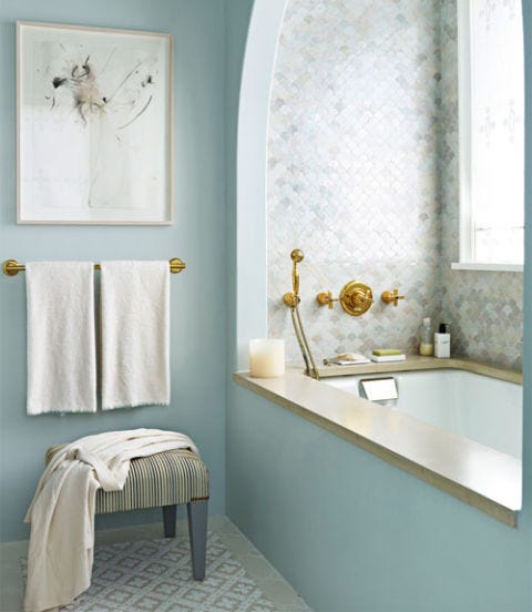 bath with blue walls and tile