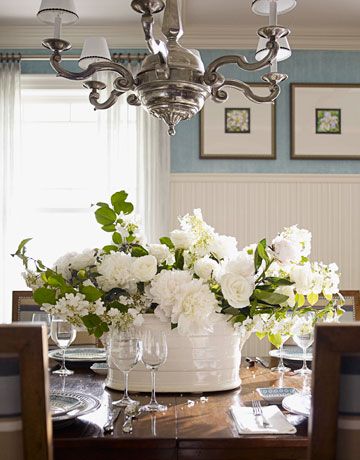 white flower arrangement on dining room table