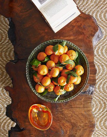 coffee table with bowl of clementines