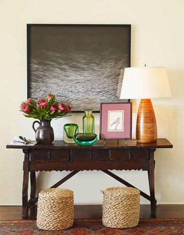 table with lamp and artwork