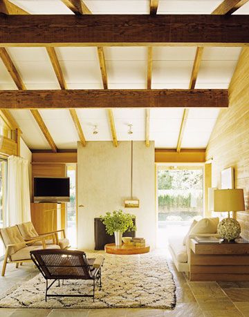 living room with exposed beams on the ceiling