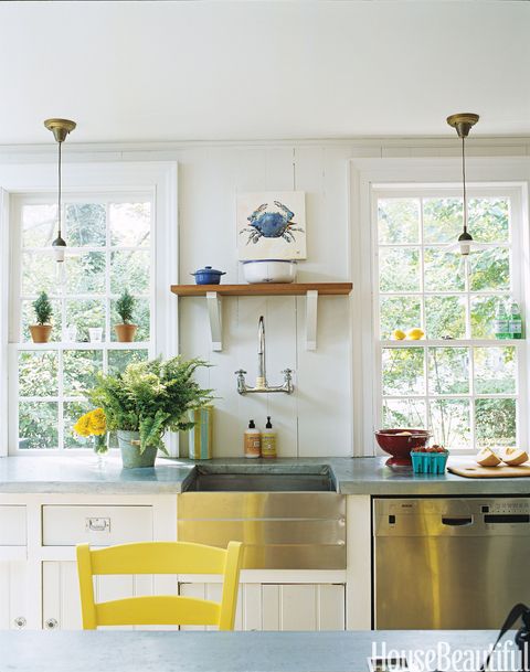 white kitchen with yellow chair