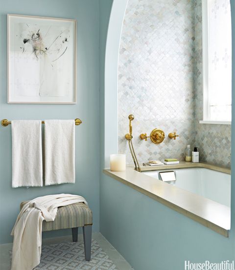 bath with blue walls and tile
