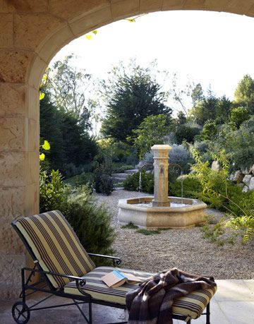 a lounge chair near a fountain