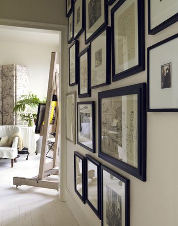 wall with black framed photos