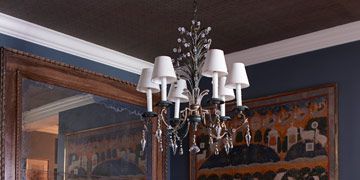 entry way with antiques and dark pink flowers