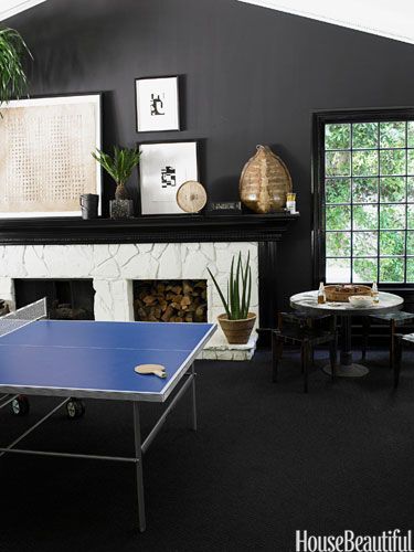 black game room with blue ping pong table