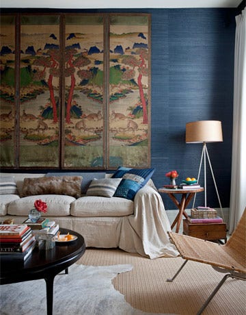 living room with mural and blue wall
