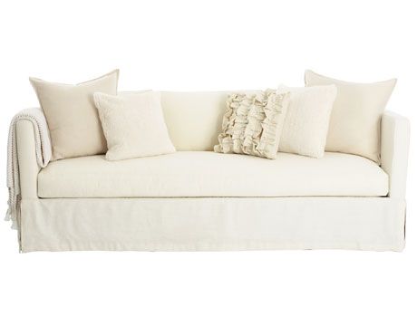 white sofa with colorful pillows