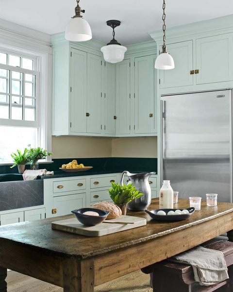 mint green kitchen with farmhouse table