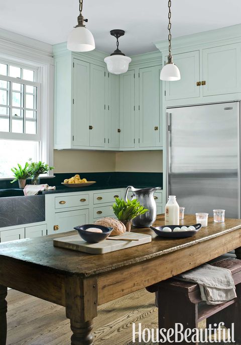 mint green kitchen with farmhouse table