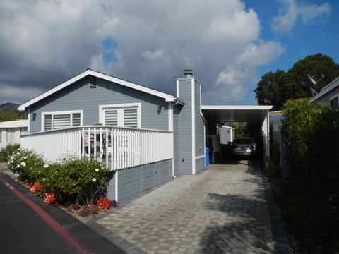Property, Cloud, Road surface, Residential area, Neighbourhood, House, Real estate, Home, Roof, Land lot, 
