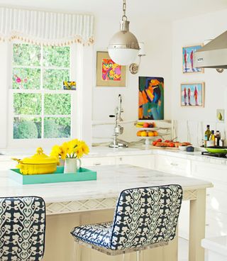 white kitchen with island and stools