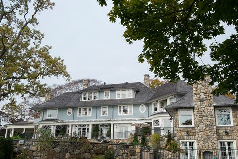 blue home with stone