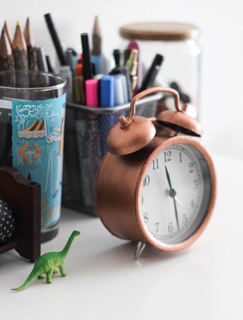 Writing implement, Reptile, Dinosaur, Stationery, Clock, Teal, Home accessories, Turquoise, Terrestrial animal, Alarm clock, 