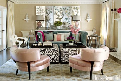 living room with pink chairs