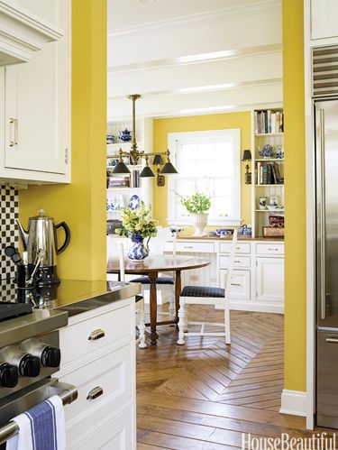 yellow kitchen with parquet floor