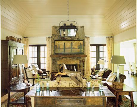 an eclectic mix of antiques in a country style living room