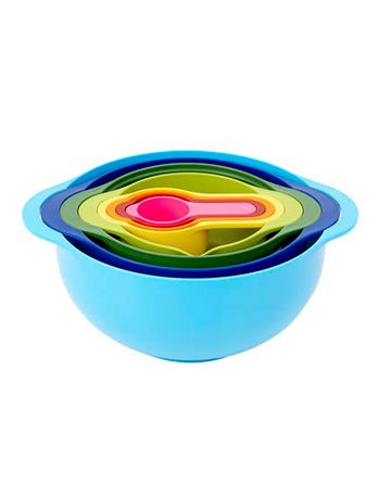 brightly colored bowls and measuring cups nested inside of each other