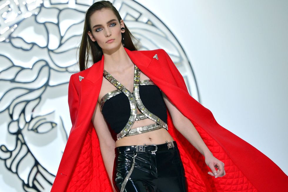 A model displays a creation as part of Versace Fall-Winter 2013-2014 Womenswear collection on February 22, 2013 during the Women's fashion week in Milan.    AFP PHOTO / GABRIEL BOUYS        (Photo credit should read GABRIEL BOUYS/AFP/Getty Images)