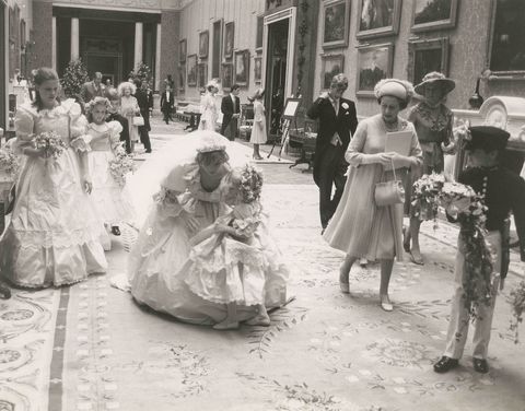 Dress, Photograph, Petal, Bridal clothing, Hat, Style, Suit, Gown, Monochrome, Wedding dress, 