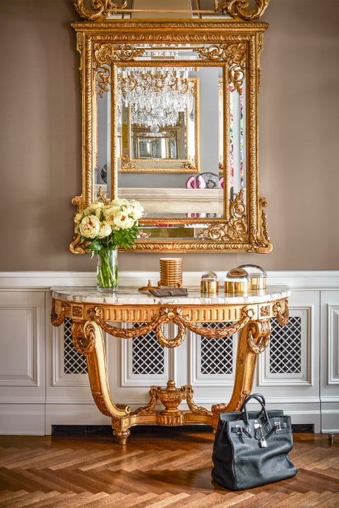 Chic Hallway <p>McKee's front hallway clad with gold accents and a vintage Birkin bag. </p>