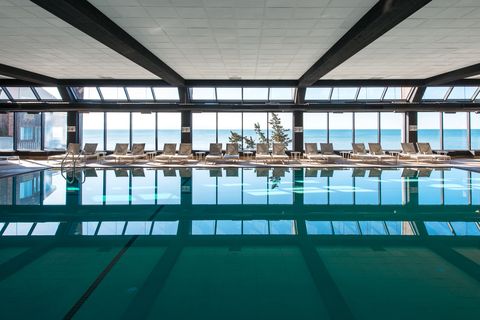 Swimming pool, Aqua, Glass, Resort, Turquoise, Daylighting, Teal, Composite material, Reflection, Hotel, 