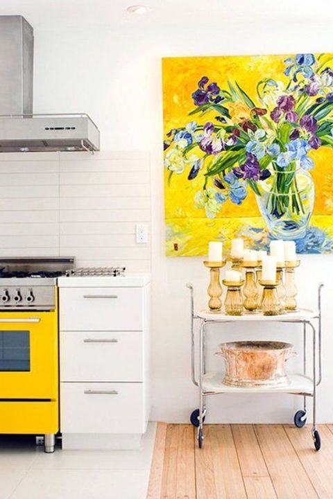 <p>Liven up white kitchen walls with a bright pop-color painting and movable cart, complete with gold candle holders for a dose of metal. </p><p><a href="http://www.apartmenttherapy.com/5-small-design-details-to-add-today-for-a-cheerier-kitchen-217993?crlt.pid=camp.oAZTGdhBszgj"></a><em><a href="http://www.apartmenttherapy.com/5-small-design-details-to-add-today-for-a-cheerier-kitchen-217993?crlt.pid=camp.oAZTGdhBszgj" target="_blank">Via Apartment Therapy</a>. </em></p>