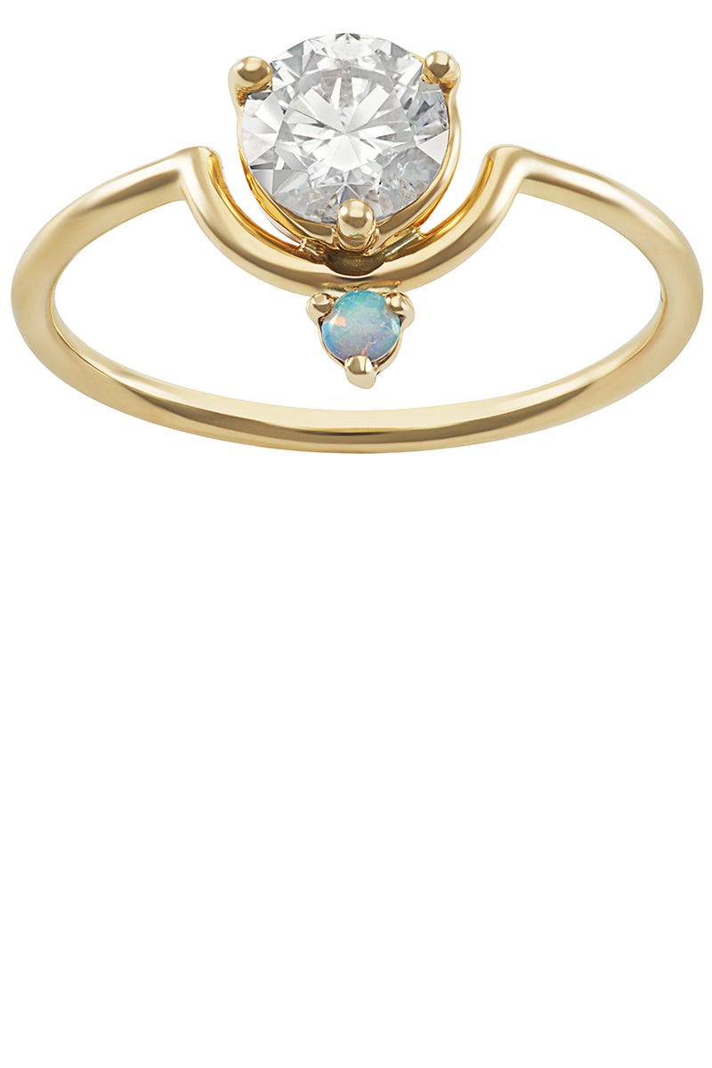 <p>Inspired by the art of breaking with convention, WWAKE offers twists on traditional pieces with dainty details and unexpected stone combinations. Their signature contour shape is a repeating theme, riffing on the ceremonial set, where an engagement ring and a wedding band are designed to fit together rather than be stacked. </p><p><em>WWAKE nestled diamond and opal ring in 14k yellow gold with opal and a .50ct white diamond. $6,500, </em><a href="http://wwake.com/"><em>wwake.com</em></a></p>