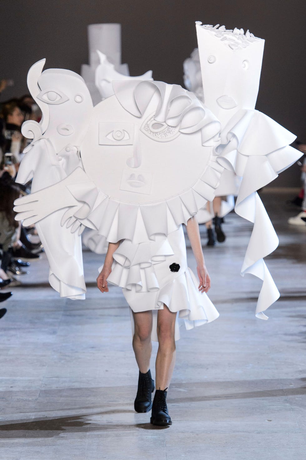 Fashion, Street fashion, Knee, Fashion model, Paper, Paper product, Boot, Fashion design, Costume design, Costume, 