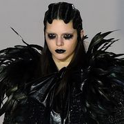 Hairstyle, Black hair, Eyelash, Fictional character, Feather, Animation, Costume, Hair coloring, Fashion model, Goth subculture, 