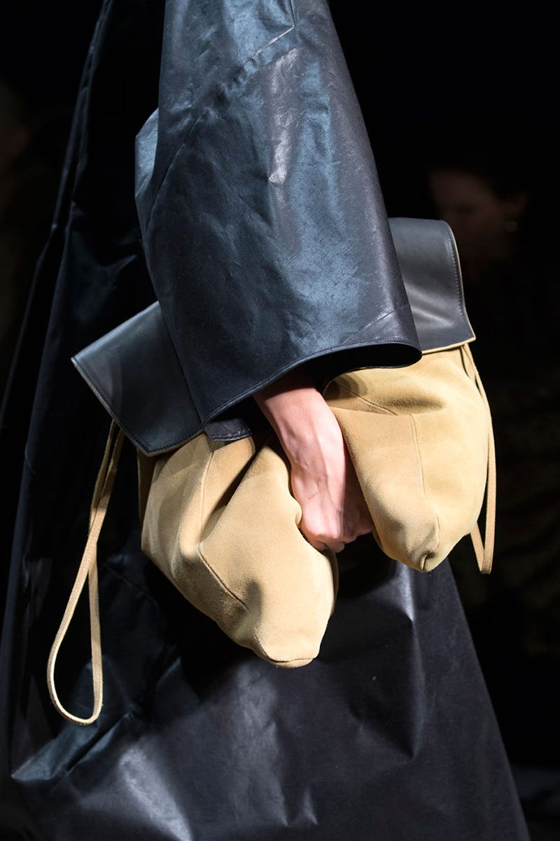 Textile, Bag, Leather, Shoulder bag, Material property, Pocket, Strap, Costume design, 