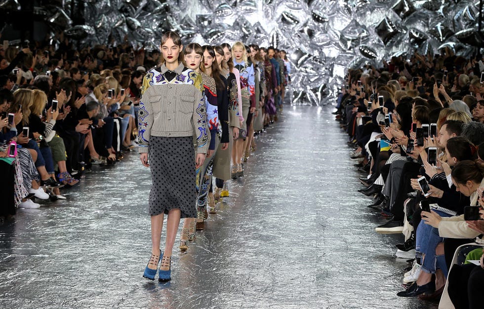 Footwear, Crowd, Style, Fashion, Street fashion, Runway, Fashion show, Light fixture, Audience, Design, 