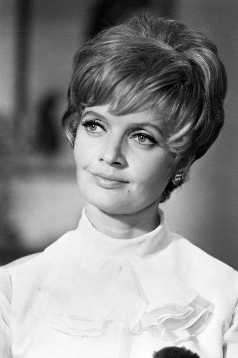 <p>A matriarch of six needs a no-nonsense hairstyle, like the teased, feathered pixie worn by Florence Henderson. </p>