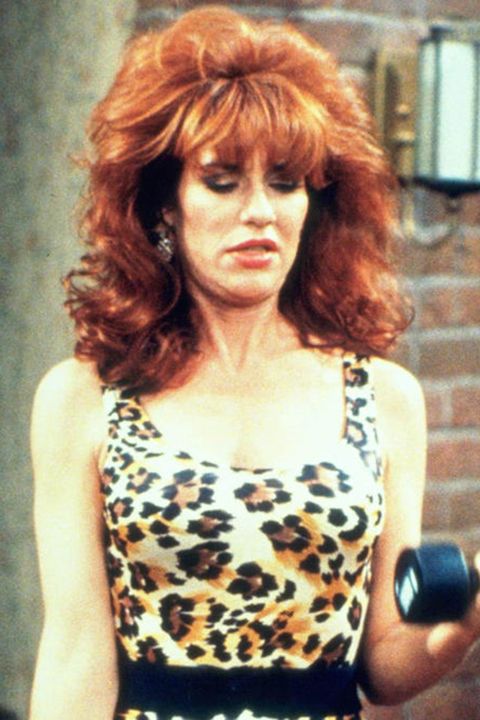 <p>Bright bottle dye, mall bangs and '80s teasing were hallmarks of the Chicago housewife's look on <em>Married...with Children</em>. </p>