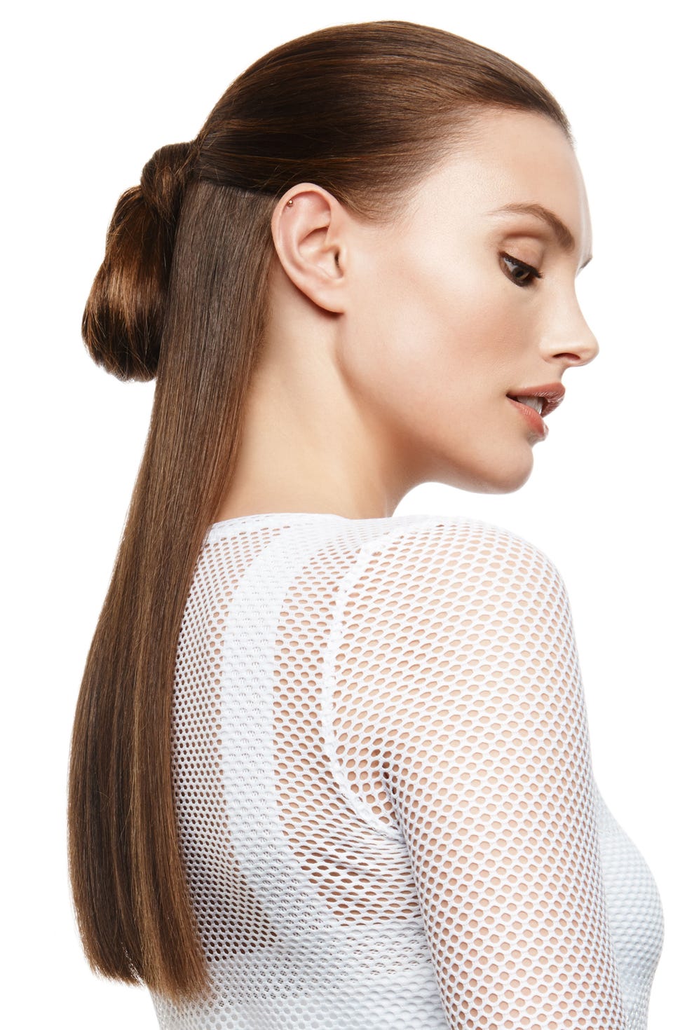 <p>This style is the ultimate muli-tasker. Your hair is pulled away from your face so you can easily move from planks to squats, and  leaving the length out lets you look put together after class, too. Pull hair into a half up-half down ponytail then only loop the length half way through, says Vigi. If your hair is on the thicker side, add a touch of <a href="http://bit.ly/1SDoUNI" target="_blank">Nexxus New York Salon Care Oil Infinite Nourishing Hair Oil</a> to ends for a polished effect.</p><p><em><strong><br></strong></em></p><p><em><strong>Heroine Sport </strong>X Bra, $95, <a href="http://www.heroinesport.com/collections/all-products/products/x-bra-white" target="_blank">heroinesport.com</a>;<strong> </strong><strong>Koral</strong> Dash L/S Tee, $95, <a href="http://www.carbon38.com/dash-l-s-tee-white?int_source=what" target="_blank">carbon38.com</a></em></p>