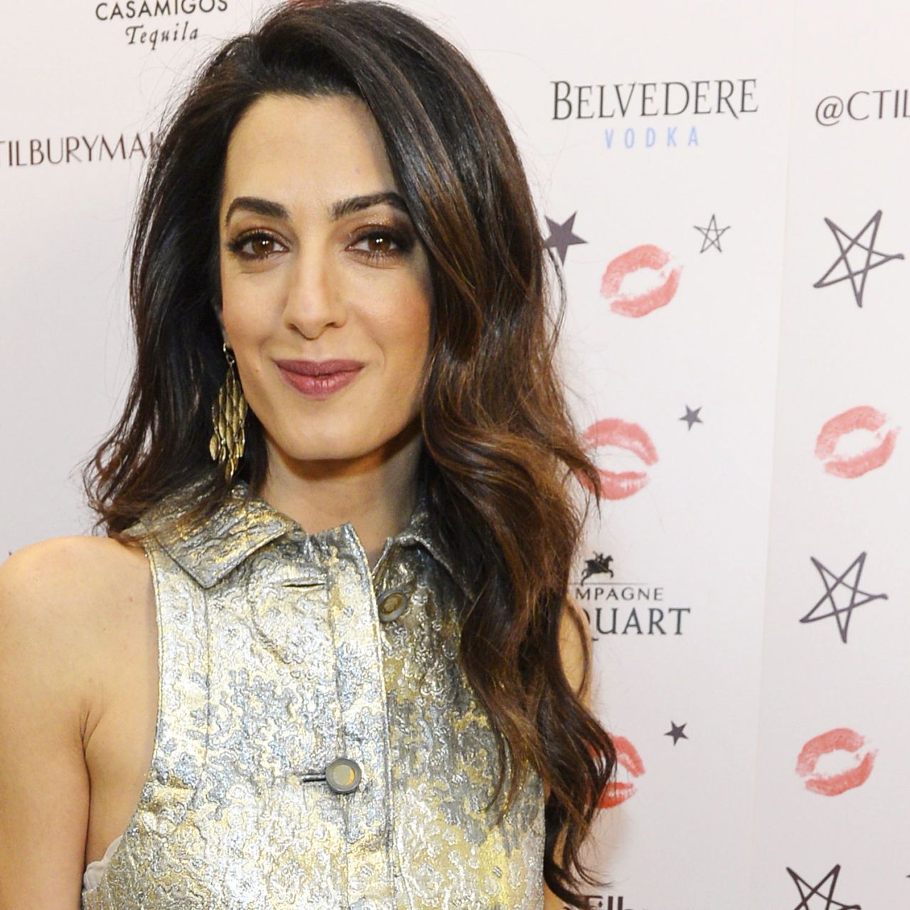 Amal Clooney takes a walk on the wild side in feathered crop top and  psychedelic flares | Irish Independent