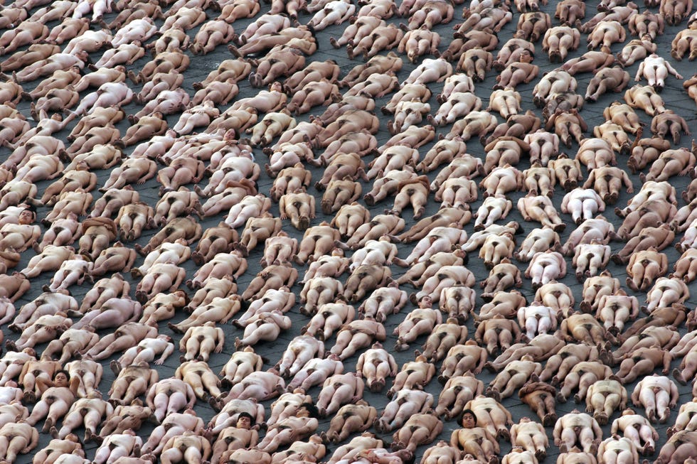 <p>Approximately 18,000 naked people pose for photographer Spencer Tunick in Mexico City, setting a new record.</p>