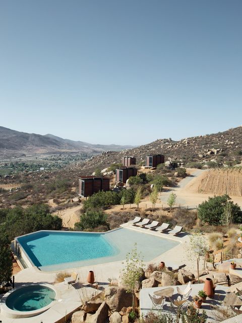 Swimming pool, Mountainous landforms, Landscape, Hill, Azure, Resort, Aqua, Valley, Resort town, Wadi, 