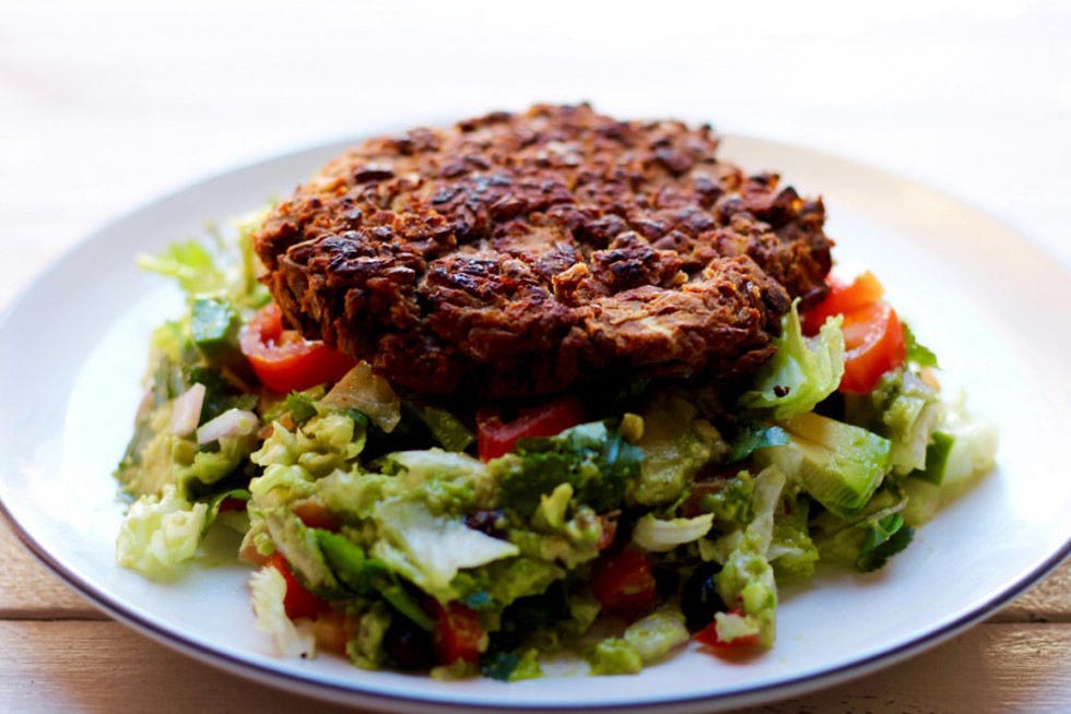 <p><a href="http://www.foodheavenmadeeasy.com/spiced-lentil-burgers/" target="_blank">Spiced Lentil Burgers </a>
</p><p>By Wendy and Jess of <a href="http://www.foodheavenmadeeasy.com/" target="_blank">Food Heaven Made Easy</a>
</p><p>Total time: 40 minutes
</p><p>Serves 4
</p><p><strong>Ingredients:</strong>
</p><ul>
<li>2 cups of cooked lentils</li>
<li> red onion, finely chopped</li>
<li>¼ cup scallions, finely chopped</li>
<li>2 tablespoons of whole wheat flour</li>
<li>1 tablespoon of ketchup</li>
<li>¼ teaspoon of chili powder</li>
<li>¼ teaspoon cumin</li>
<li>¼ teaspoon garlic powder</li>
<li>Salt to taste</li>
</ul><p><strong>Directions: </strong>
</p><ul>
<li>Pre-heat the oven to 400° F.</li>
<li>In a bowl, combine the lentils with onions, scallions, ketchup, and spices.</li>
<li>Using a large spoon or a pestle, mash up all ingredients in the bowl until the consistency is uniform.</li>
<li>Slowly add in the flour, and mix it in while doing so. Add a pinch of salt, and mix it in.</li>
<li>Using a spoon, scoop 4 balls of the lentil mash onto a non-stick baking tray.</li>
<li>Once on the tray, flatten them out into the shape and thickness of a burger.</li>
<li>Bake for 15 min on 400F. Flip over and bake the opposite side for another 15 min.</li>
<li>Enjoy with bread or your favorite greens!</li>
</ul><p>NOTE: If you plan on storing them, you can either wrap each patty individually in plastic, or you can line each one with wax paper, and then stack them in a container. Then they can go right into the freezer! Whenever you're ready, just de-frost and bake them.</p>