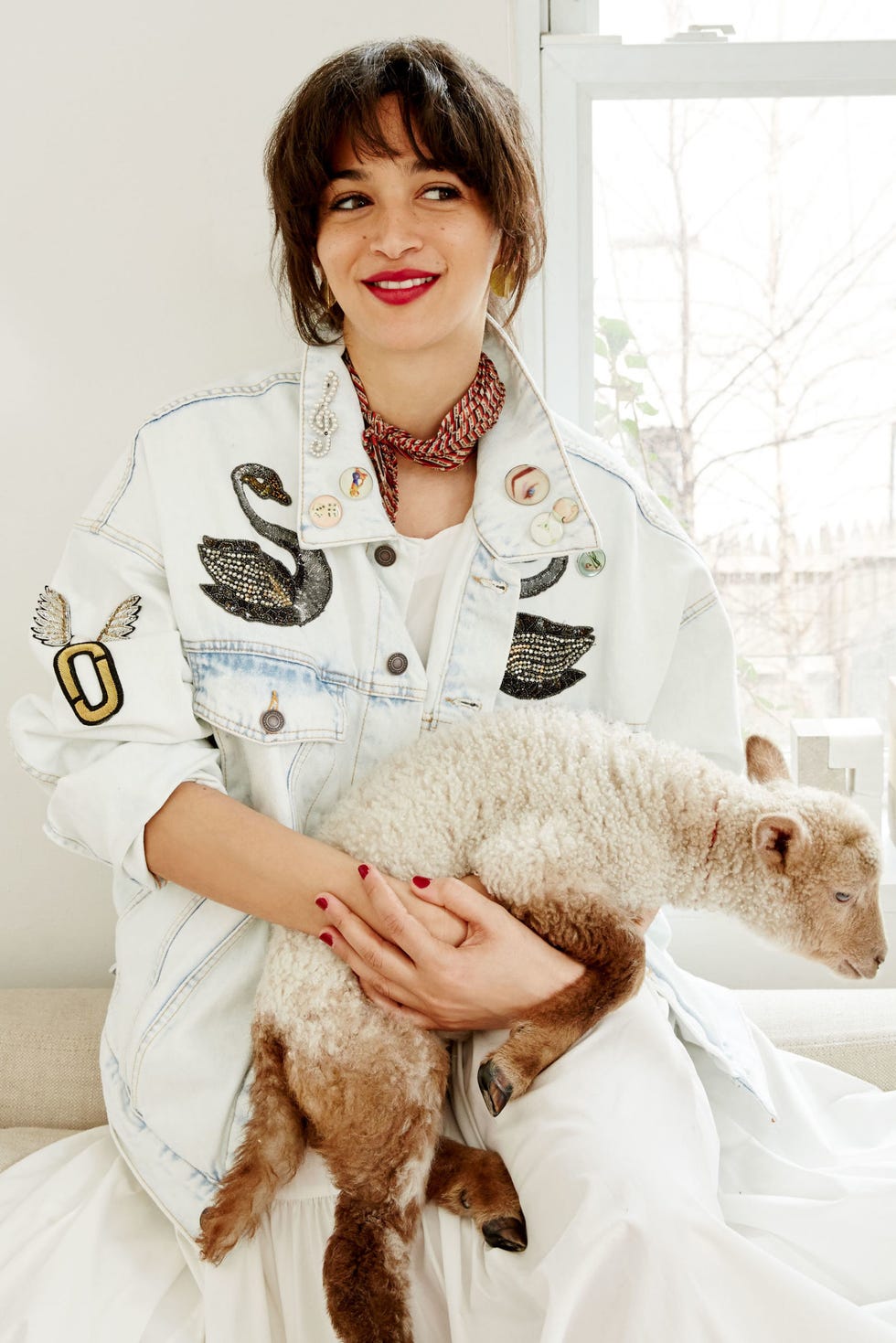 <p><strong>Tell us about your adorable pet.</strong></p><p>Ziki was abandoned by her mom at a farm in West Winfield, New York. Mary, the farmer, was looking for foster parents for some of the abandoned baby lambs. They're bottle babies that need to be fed every few hours. I agreed to take a little girl and she moved into my Manhattan apartment!</p><p><em>Marc Jacobs Oversized Bleached Denim Jacket, $750, for similar styles visit <a href="http://shop.nordstrom.com/sr?keyword=marcjacobs&contextualcategoryid=0" target="_blank">nordstrom.com</a>; Maryam Nassir Zadeh Carnelia Dress, $648, for similar colors visit <a href="http://www.mnzstore.com/collections/clothing/products/carnelia-dress-grey-paper-cotton" target="_blank">mnzstore.com</a>; scarf, Gohar's own</em></p><p><em><br></em></p><p><em>Stylist: Shibon Kennedy; Hair: Joey George; Makeup: Christine Cherbonnier</em></p>