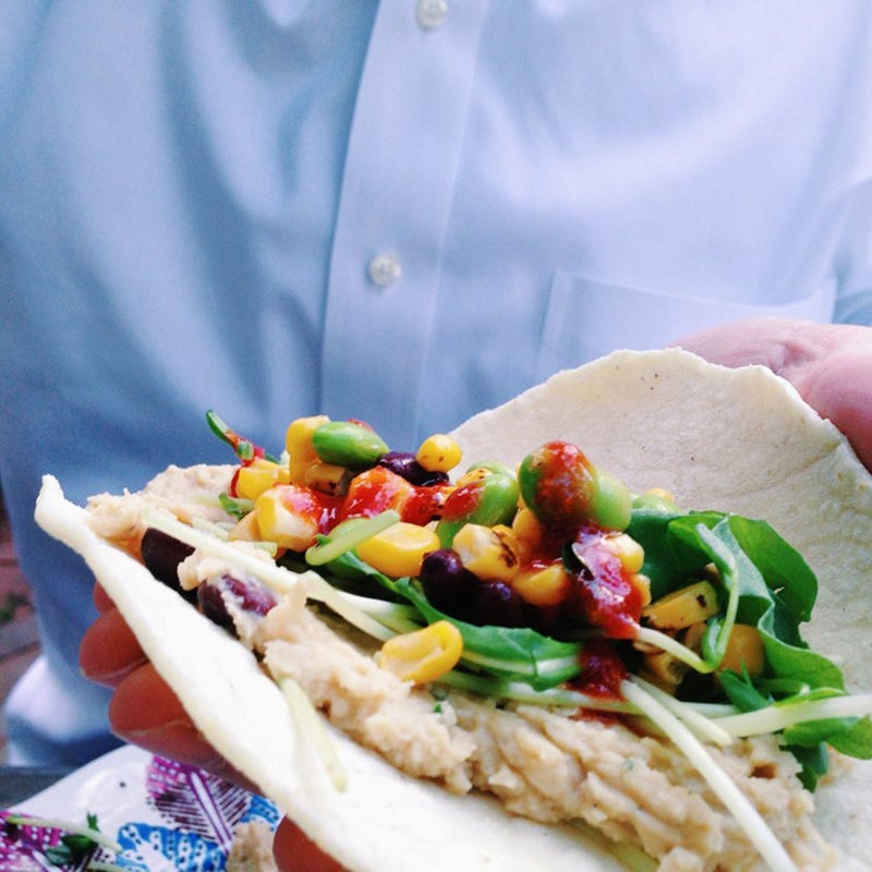 <p>½
</p><p><a href="http://www.sheloveseverything.com/recipes/2015/9/30/hummus-tacos-with-crunchy-lime-cucumbers" target="_blank">Hummus Tacos with Crunchy Lime Cucumbers</a></p><p>By Emily Sundberg of <a href="http://www.sheloveseverything.com/" target="_blank">She Loves Everything</a></p><p><strong>Ingredients: </strong></p><p><em>Cucumber Lime Crunchy Salad</em></p><ul>
<li>5 small cucumbers, or 2 large ones. Halved and sliced into half circles</li>
<li>1/2 red onion, diced or sliced into whatever way you like it</li>
<li>handful of cilantro, chopped</li>
<li>2 limes, juiced</li>
<li>½tsp of tamari or liquid aminos</li>
<li>pinch of salt (optional, but it really pulls the water out of the cucumbers and lets it all marinate together!)</li>
<li>Let these marinate for about an hour for optimal flavor, but if you must serve right away it will be just as delicious!</li>
</ul><p><em>Black Bean, Edamame, Roasted Corn slaw</em></p><ul>
<li>1 can of organic black beans, rinsed thoroughly</li>
<li>1 1/2 cup shelled edamame</li>
<li>3 ears of corn, roasted and kerneled</li>
<li>3 tbs of your favorite hot sauce</li>
<li>Heat all these ingredients up and mix together with your favorite hot sauce. Put aside.</li>
</ul><p><em>Homemade Hummus</em></p><ul>
<li>2 cans of organic chickpeas, rinsed thoroughly OR fresh cooked/sprouted chickpeas</li>
<li>2 tbs stone ground tahini</li>
<li>2 lemons, juiced</li>
<li>4 cloves of garlic, roasted in a tiny bit of EVOO</li>
<li>handful of cilantro</li>
<li>1 tsp cumin</li>
<li>handful of fresh ground cracked pepper</li>
</ul><p><strong>Directions: </strong></p><ul>
<li>Blend these all up in a food processor or Vitamix or high powered blender. Try not to eat the whole thing with a spoon.</li>
<li>When using soft corn tortillas, it works best if you heat them a bit before serving in a tiny bit of coconut oil so they taste a little better and aren't that 'straight from the package' feel. Load all your ingredients in and top with sprouts for more of that crunch and tons of lime and hot sauce!</li>
</ul>