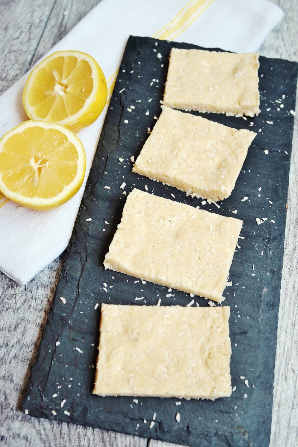 <p><a href="http://carrotsncake.com/2016/05/no-bake-lemon-coconut-protein-bars.html" target="_blank">No-Bake Lemon Coconut Protein Bars</a>
</p><p>By Tina Haupert of <a href="http://carrotsncake.com/" target="_blank">Carrots N' Cake</a>
</p><p><strong>Ingredients:<br><br>
</strong></p><ul>
<li>½ cup coconut (or vanilla) protein powder (I used SFH Coconut Fuel)</li>
<li>½ cup melted coconut oil</li>
<li>¾ cup unsweetened shredded coconut</li>
<li>2 tbsp honey</li>
<li>2 tbsp lemon juice + zest to taste (I zested about 1/3 of a lemon)</li>
<li>2 tbsp coconut flour</li>
</ul><p><strong>Directions:<br><br>
</strong></p><ul>
<li>Combine ingredients in a mixing bowl. </li>
<li>Line a small baking dish with parchment paper. </li>
<li>Spread batter inside, using a spatula to flatten. </li>
<li>Refrigerate for 45 minutes. </li>
<li>Cut into 12 bars and serve immediately!</li>
<li></li>
</ul>