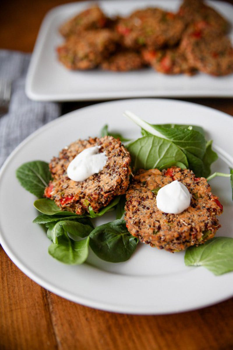 <p><a href="http://www.katheats.com/salmon-quinoa-burgers-with-mint-yogurt-sauce" target="_blank">Salmon Quinoa Burgers with Mint-Yogurt Sauce</a> </p><p>By Kath Younger of <a href="http://www.katheats.com/" target="_blank">Kath Eats Real Food</a></p><p>Makes about a dozen</p><p><strong>Ingredients:</strong></p><ul>
<li>14 ounce cans of wild salmon</li>
<li>¾ cup cooked quinoa, cooled</li>
<li>¼ cup bell pepper, chopped</li>
<li>1 roasted red pepper (homemade or jarred), chopped</li>
<li>¼ cup chia seeds</li>
<li>1 egg</li>
<li>¼ tsp smoked paprika</li>
<li>¼ tsp chili powder</li>
<li>¼ tsp cumin</li>
<li>¼ tsp red pepper flakes</li>
<li>For The Yogurt Sauce</li>
<li>1 cup Greek yogurt</li>
<li>10 mint leaves, minced</li>
<li>Juice of half a lemon</li>
<li>Salt and pepper to taste</li>
</ul><p><strong>Directions:</strong></p><ul>
<li>Preheat oven to 375°</li>
<li>Prepare quinoa or use leftovers</li>
<li>Open and drain salmon if necessary and place in large mixing bowl</li>
<li>Add peppers and spices and mix well.</li>
<li>Crack an egg into the mixture and mix well</li>
<li>Add chia seeds and mix. Allow for the mixture to sit for a few minutes. Add more chia if mixture seems too wet.</li>
<li>Grease a baking sheet. Using an ice cream scoop, create about a dozen patties and use clean, wet hands to press them down and shape into burgers.</li>
<li>Place in oven and bake for 15-20 minutes, until you can flip them without them crumbling. Flip and then allow to bake for 15 more minutes.</li>
<li>Combine mint, yogurt, lemon, salt and pepper for a simple yogurt sauce and top patties with a dollop to serve.</li>
</ul>