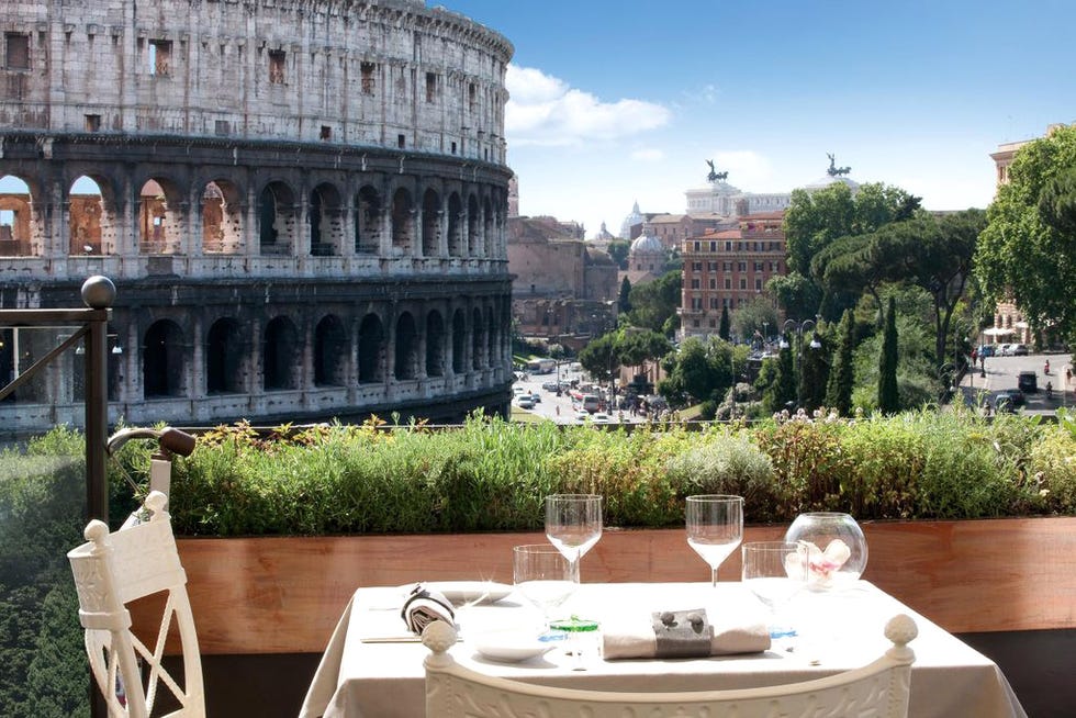 Tablecloth, Table, Furniture, Ancient rome, Outdoor furniture, Glass, Outdoor table, Linens, Stemware, Wine glass, 